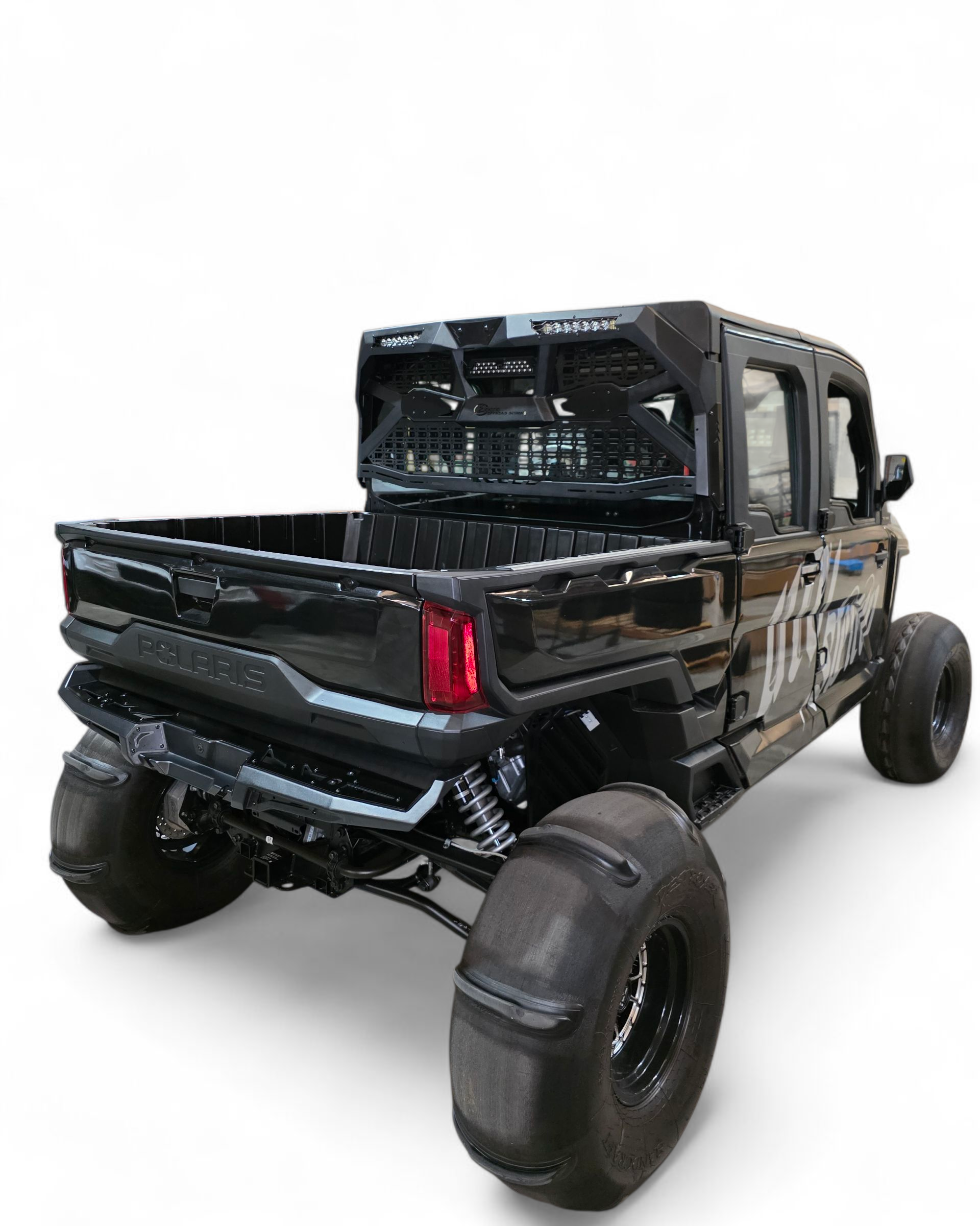 Black off-road truck with large tires on a white background