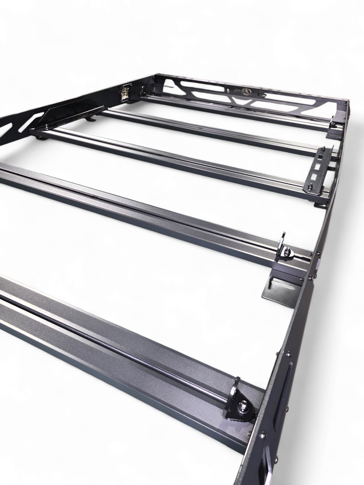 Low-angle view along the roof rack length showing the crossbars