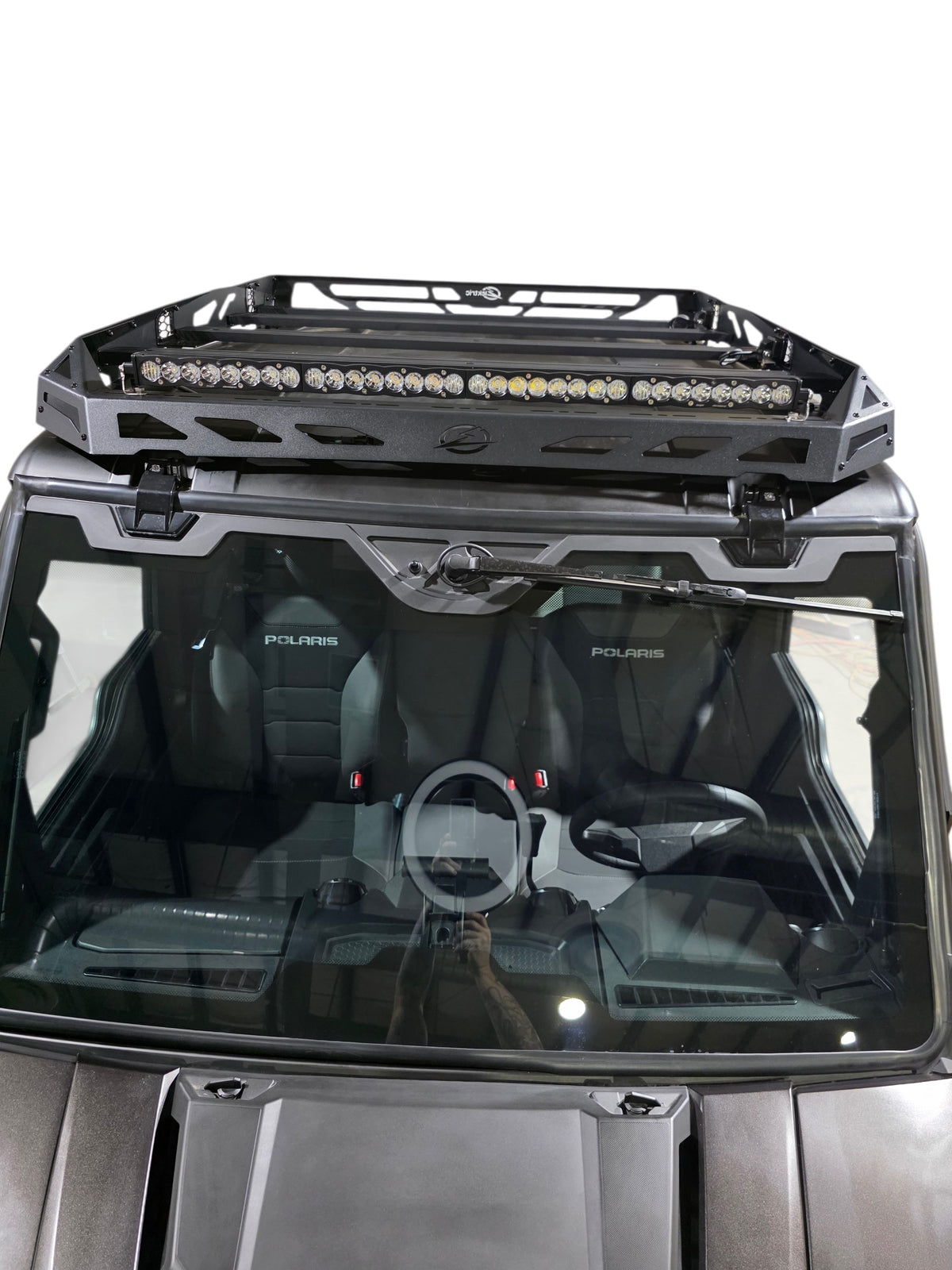 Front view of the installed roof rack with an LED light bar above the Xpedition windshield