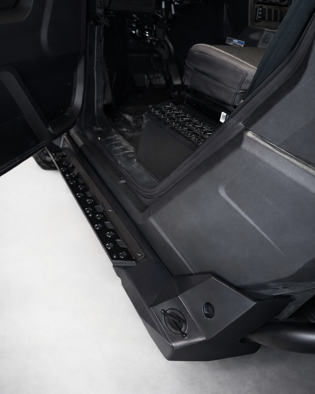 Side profile of 2-seat Polaris Xpedition with rock steps installed
