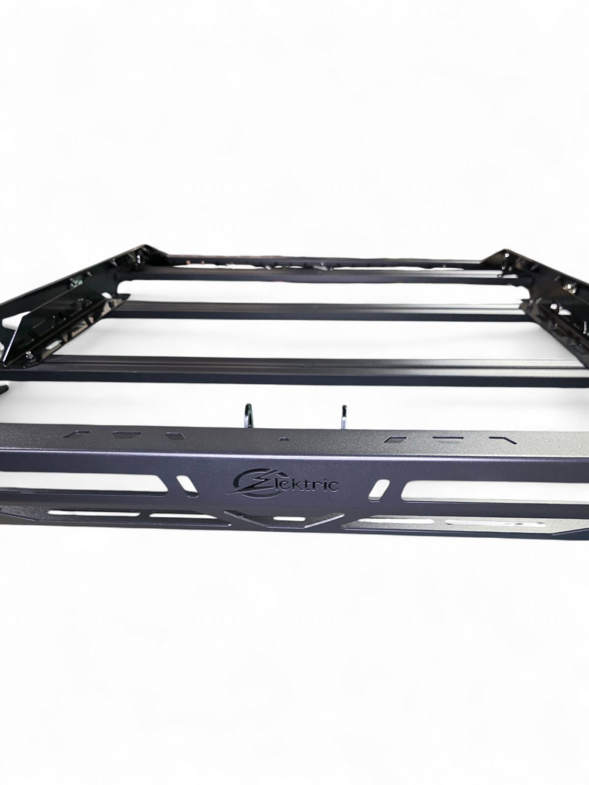 Close view of the roof rack front rail with the Elektric Offroad Designs logo and crossbars
