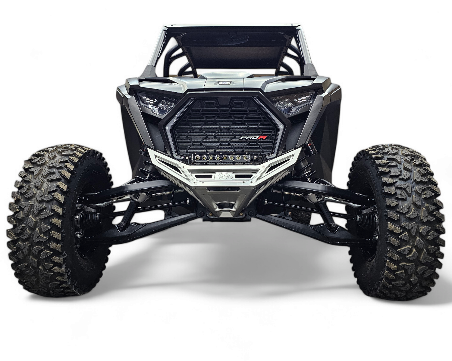 Front three-quarter view of Polaris RZR clear billet front winch bumper showing CNC machining