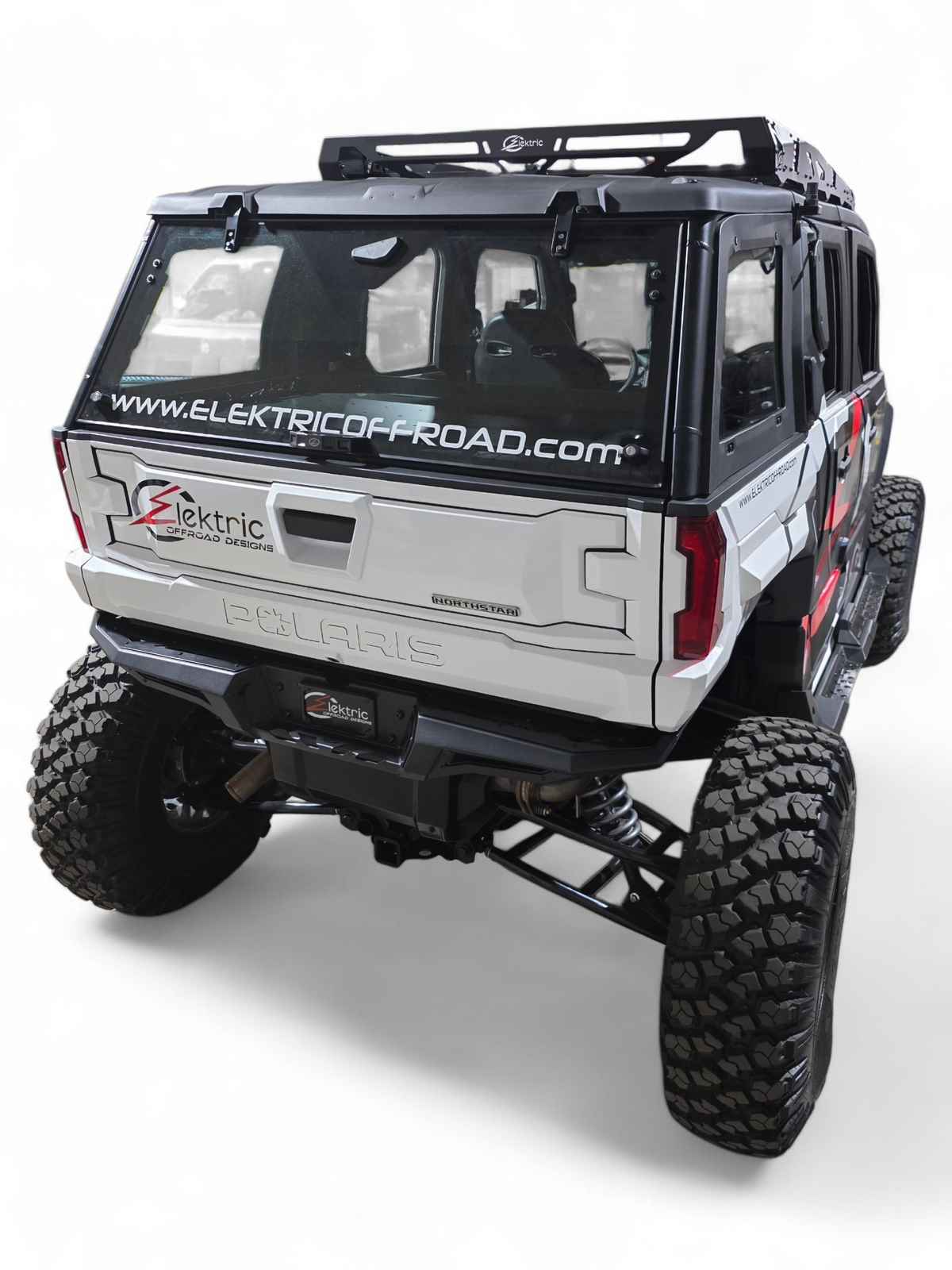 Rear corner view of a white 4-seat Polaris Xpedition with EOD graphics and rear bumper