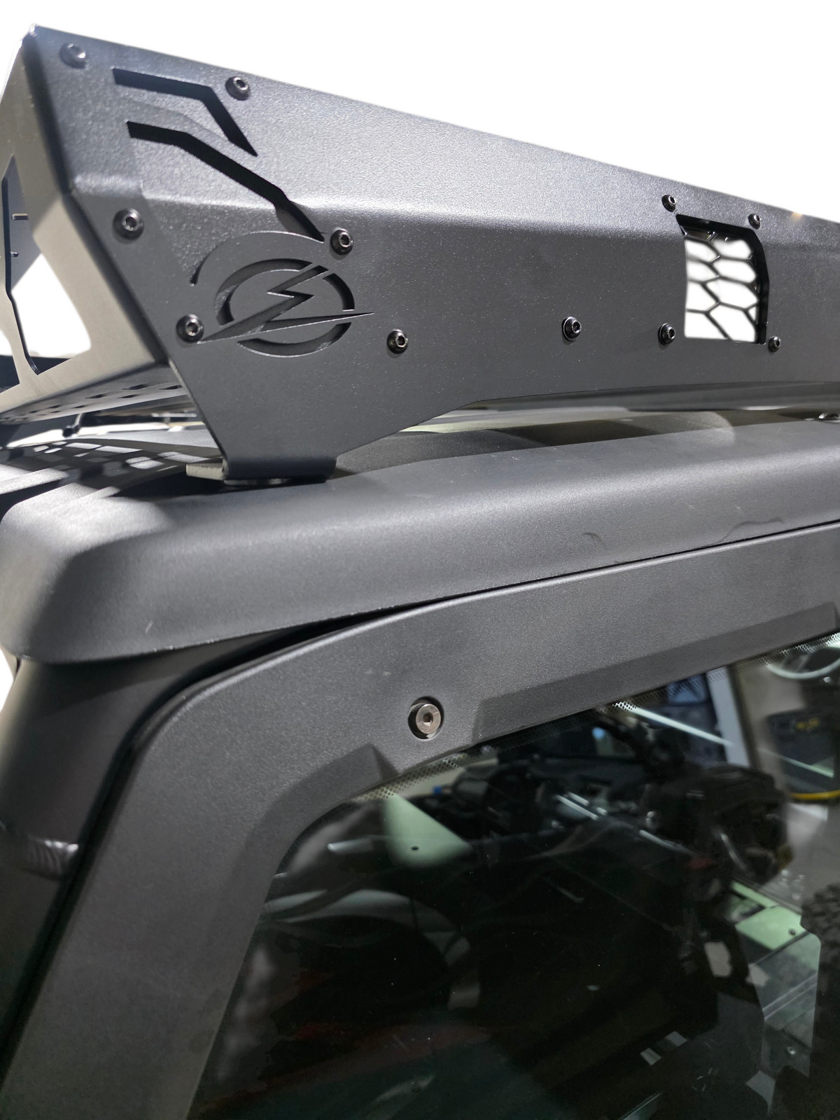 Roof rack corner with a mounted light pod on the Xpedition roof