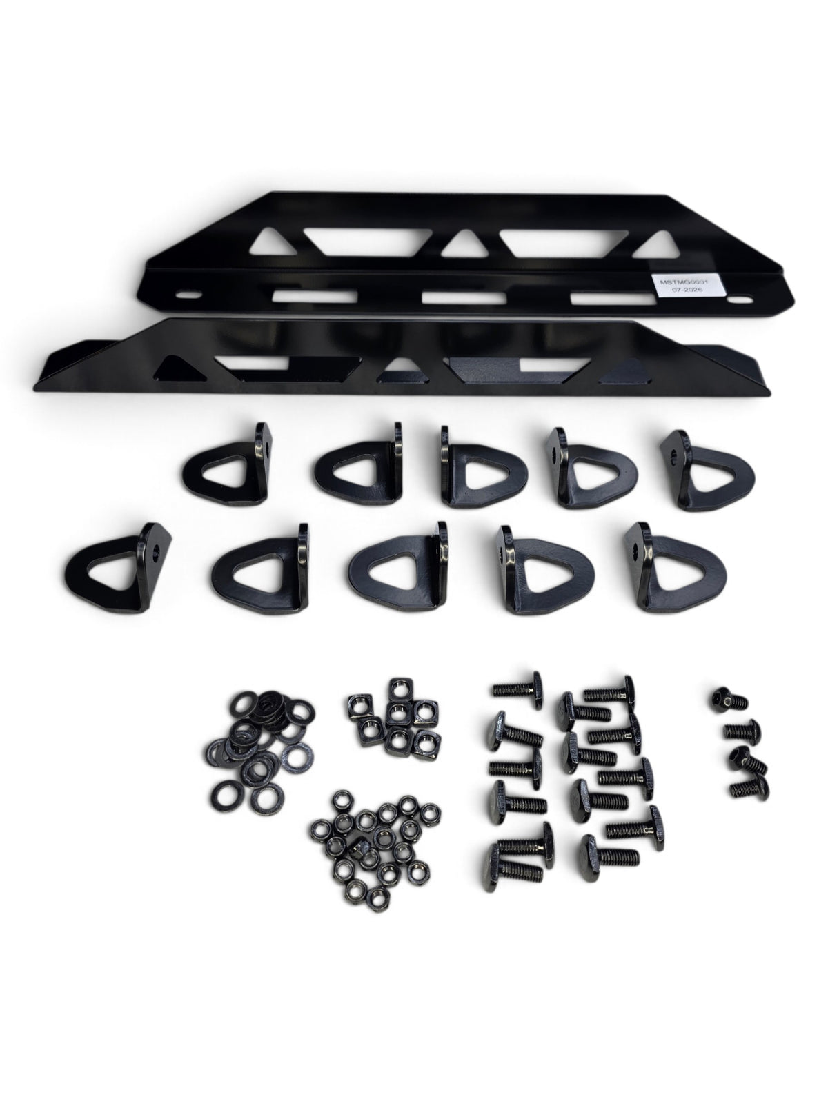 Kit contents laid out: a dual-slot E-Track mount, tie-down points, and hardware