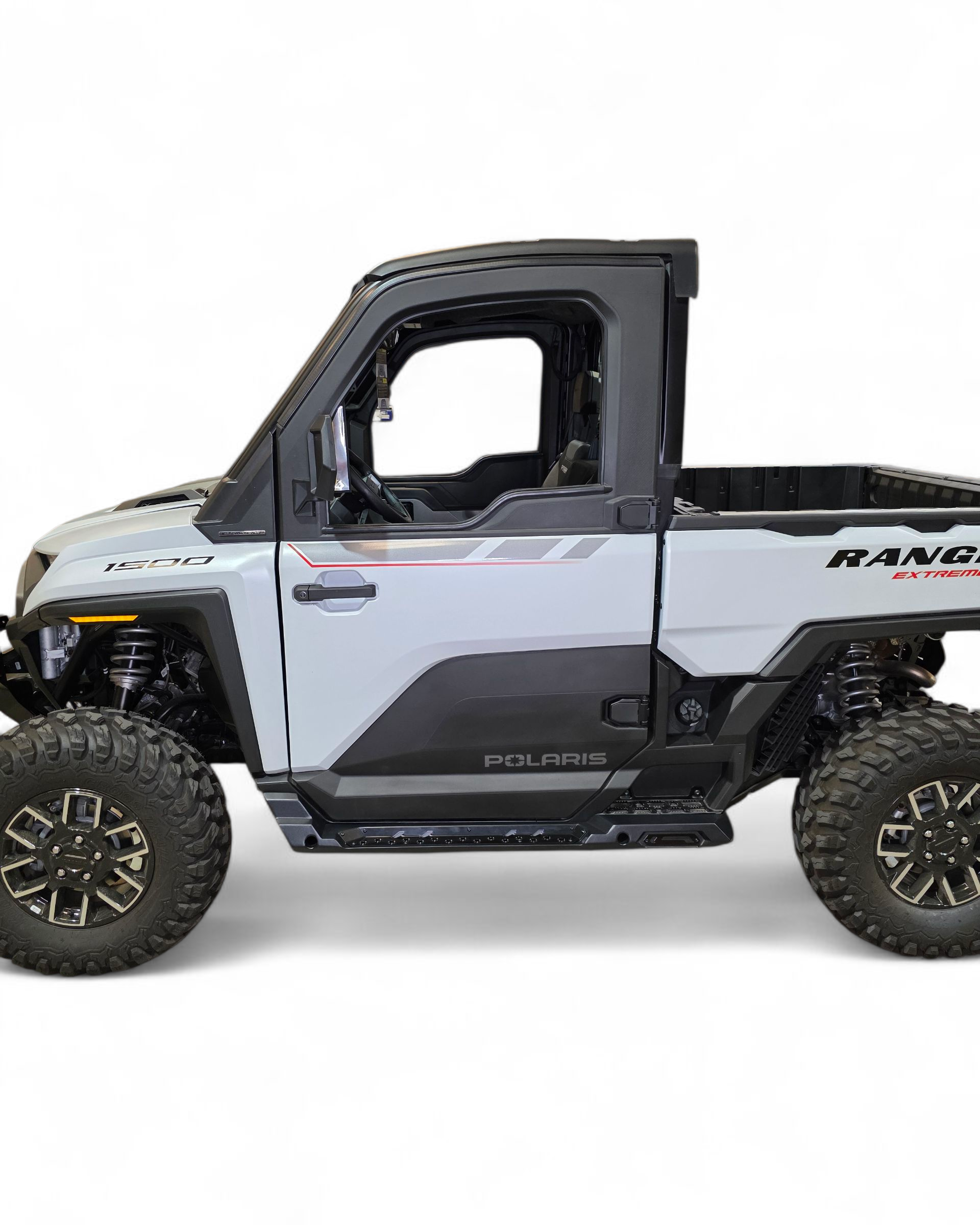 Side profile of 2-seat Polaris Ranger XD 1500 with rock sliders installed