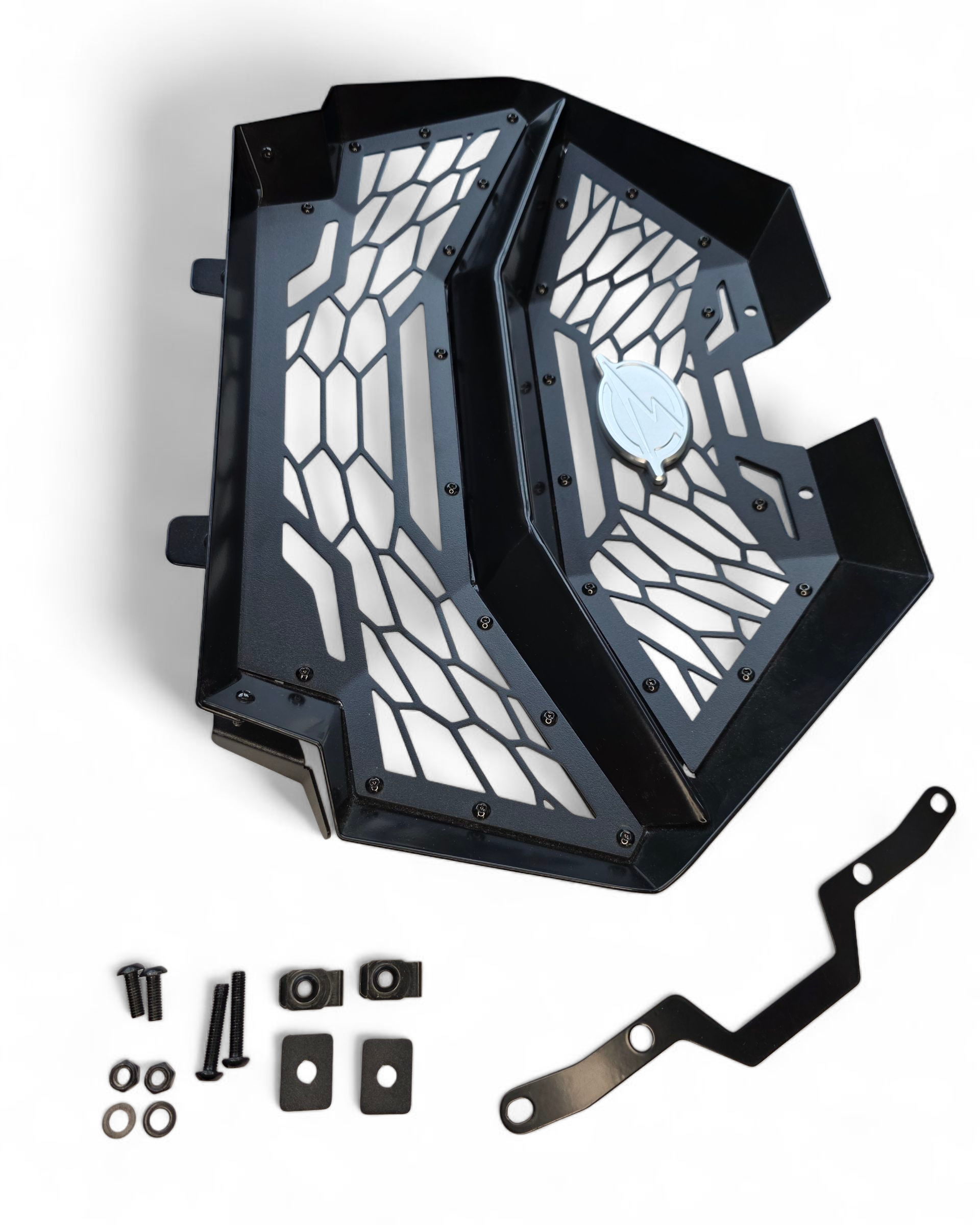 Close-up of billet aluminum EOD badge on Polaris RZR Volt grille