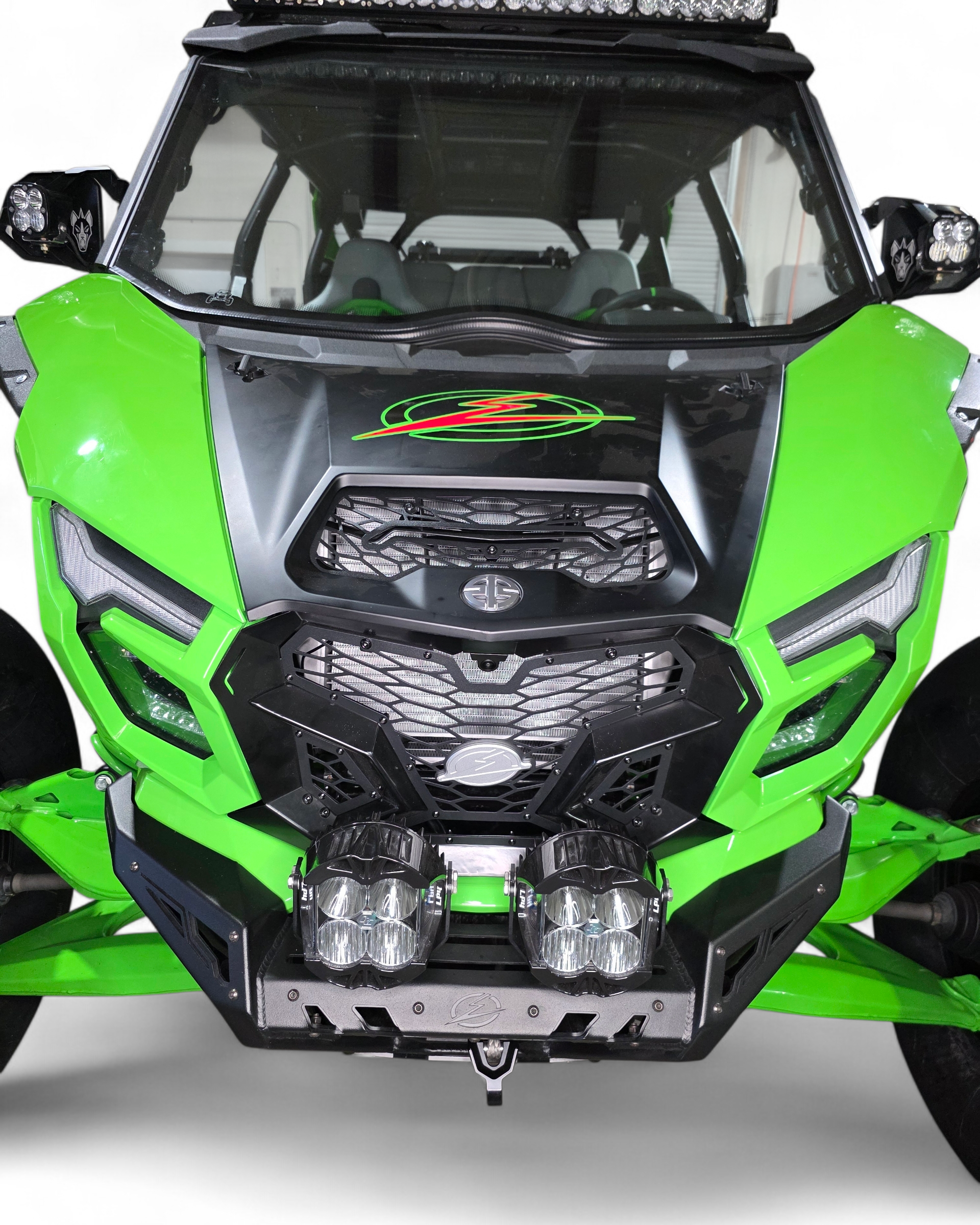Close-up of billet aluminum EOD badge on Kawasaki Teryx H2 Volt grille