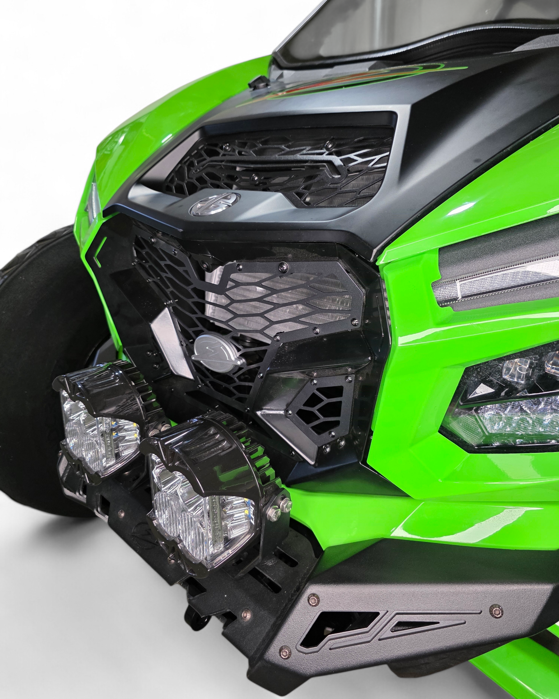 Three-section layout of Kawasaki Teryx H2 Volt front grille shown before installation