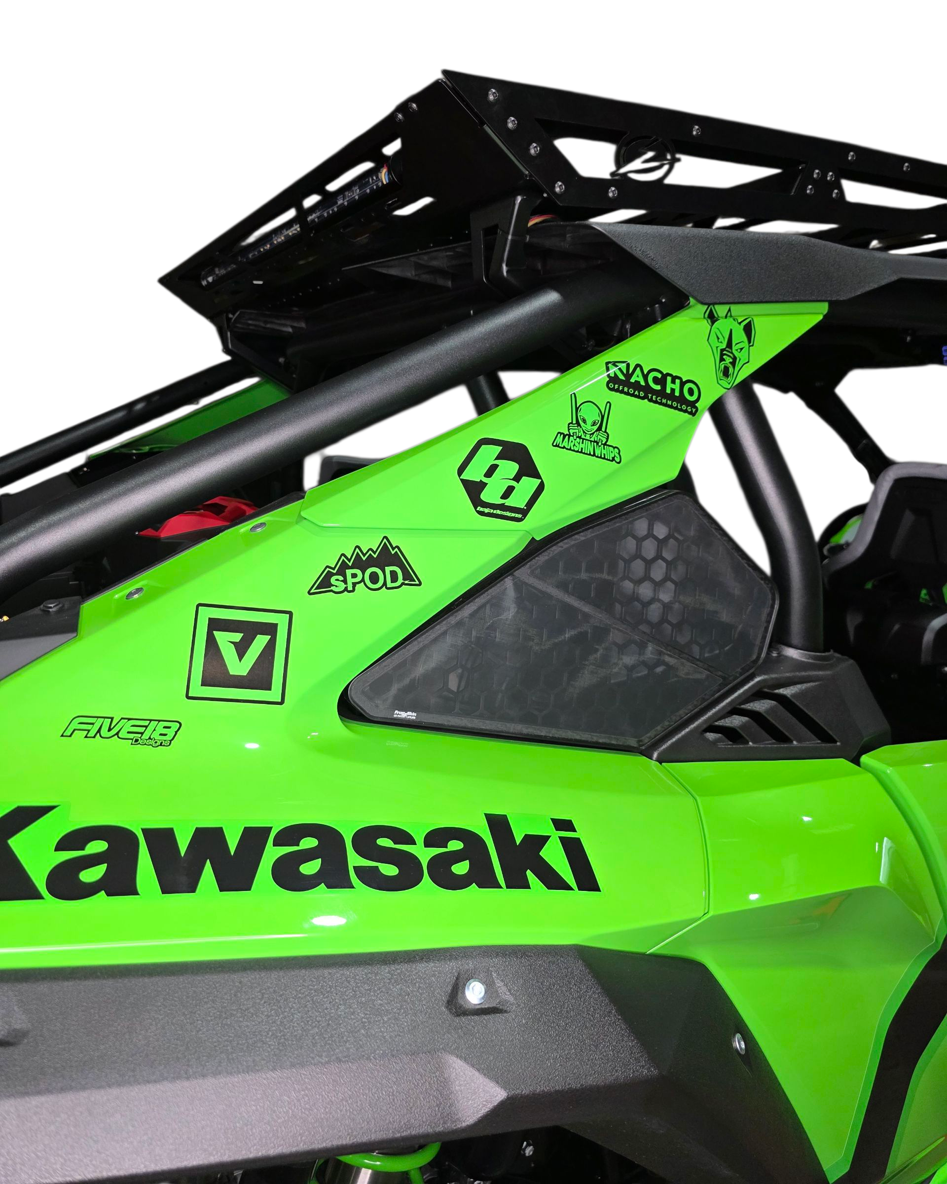Close-up of a green Kawasaki vehicle with various decals on a white background