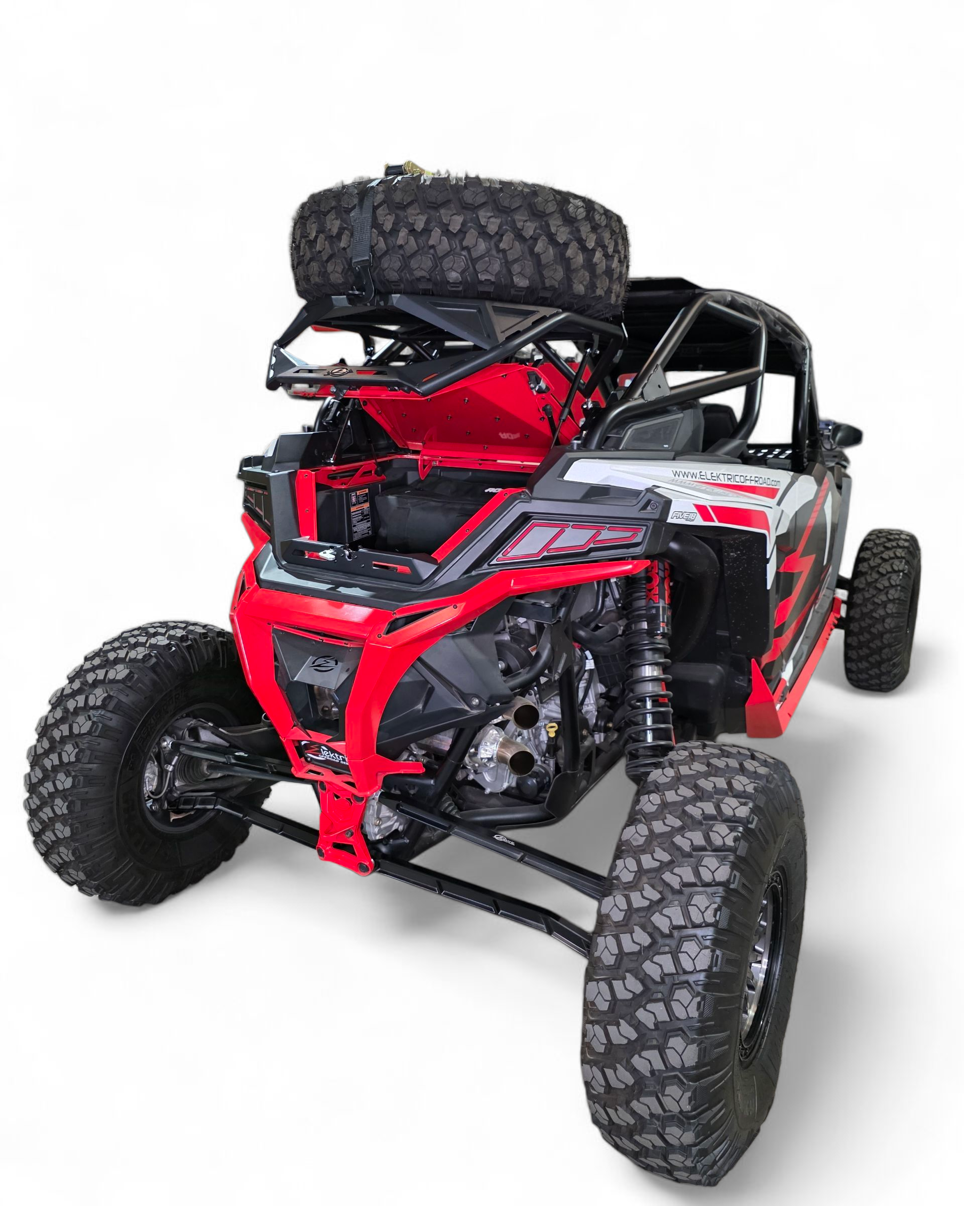 Rear three-quarter view of Polaris RZR high clearance tire rack with spare mounted