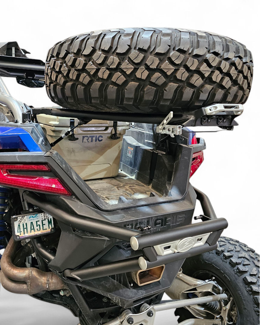 Spare tire carrier with Y-strap hold-down mounts on Polaris RZR Pro R combo