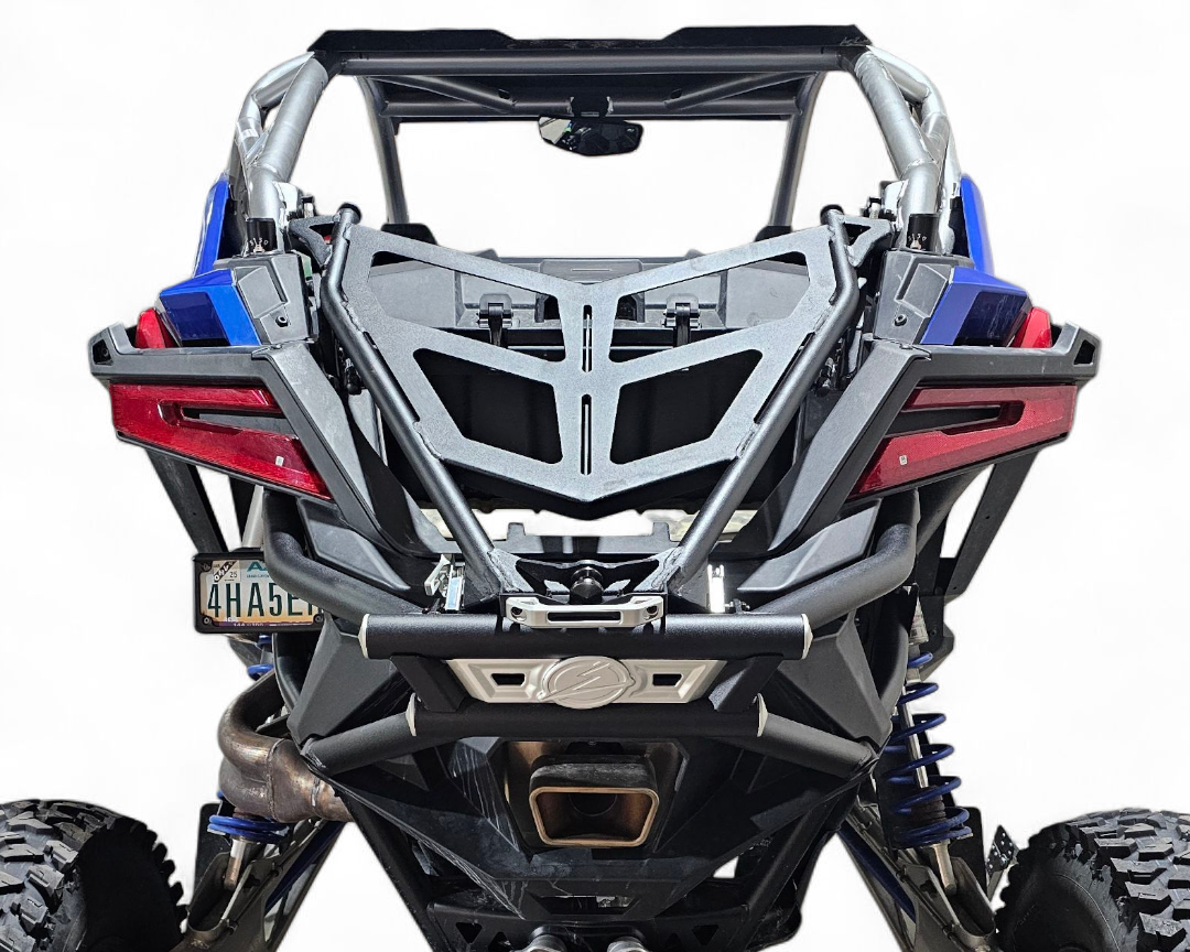Y-strap hold-down mount detail securing spare on Polaris RZR Pro R combo