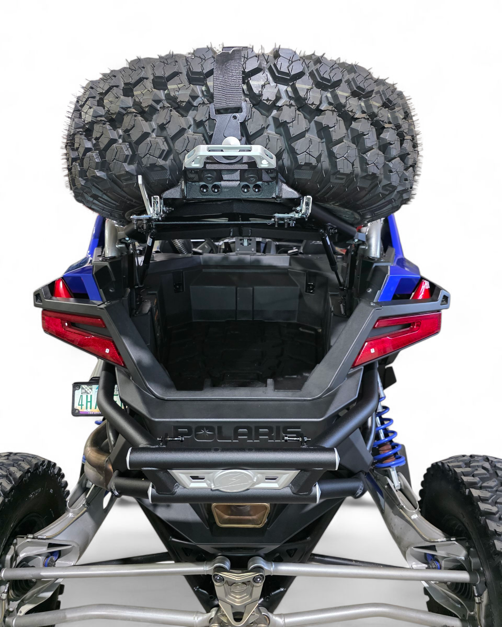 Spare tire carrier with Y-strap hold-down mounts on Polaris RZR Pro R combo