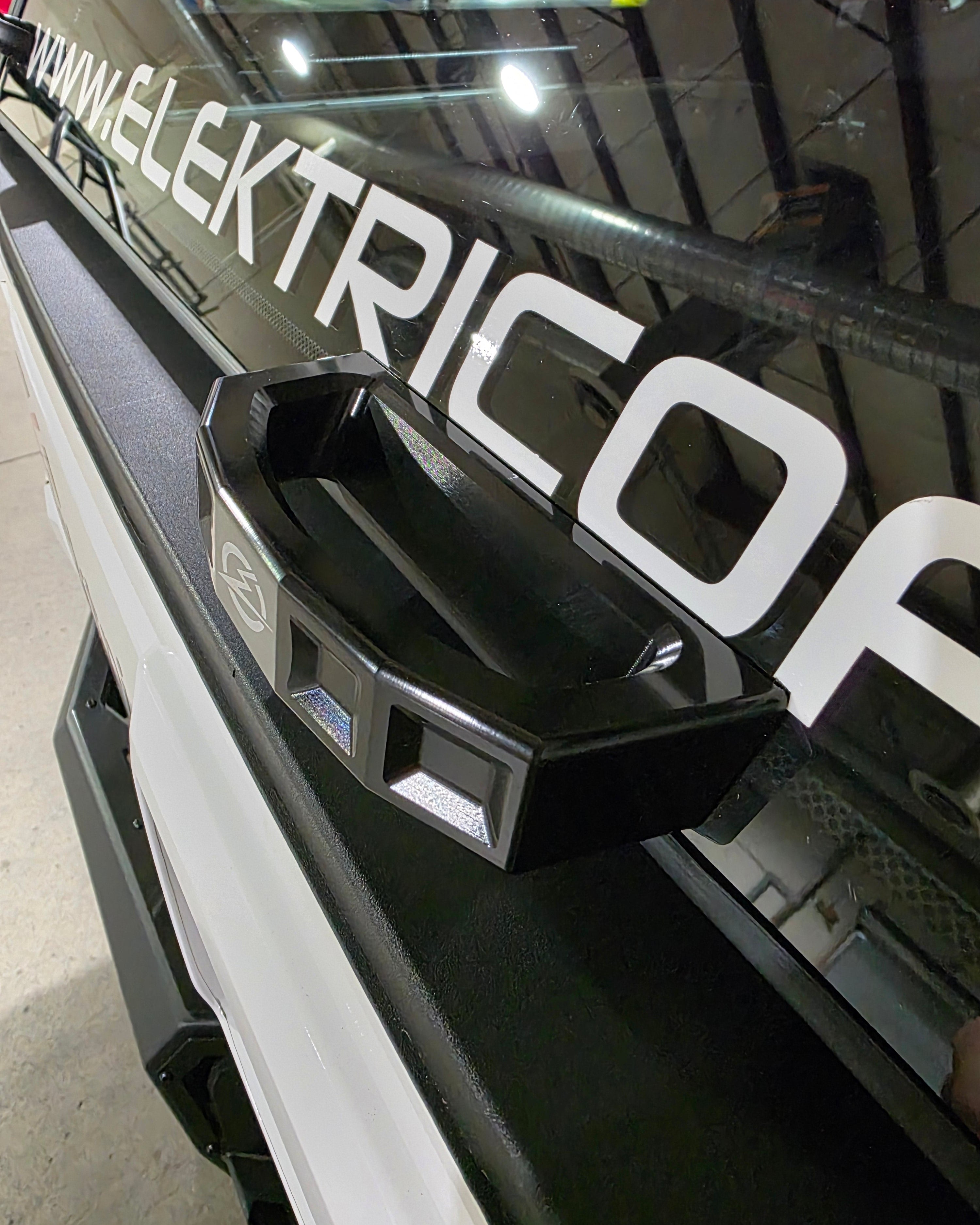 Close-up of anodized black billet finish on Polaris Xpedition rear glass handle