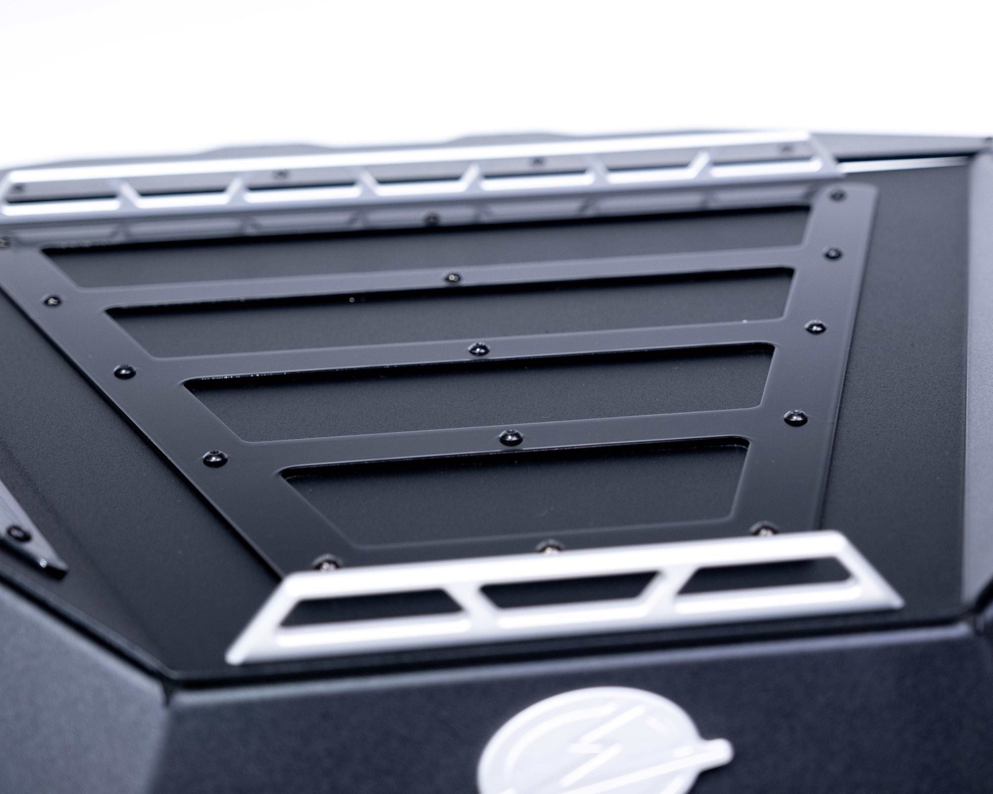 Gear strapped to tie-down rails on top of Polaris RZR Baja bed box lid