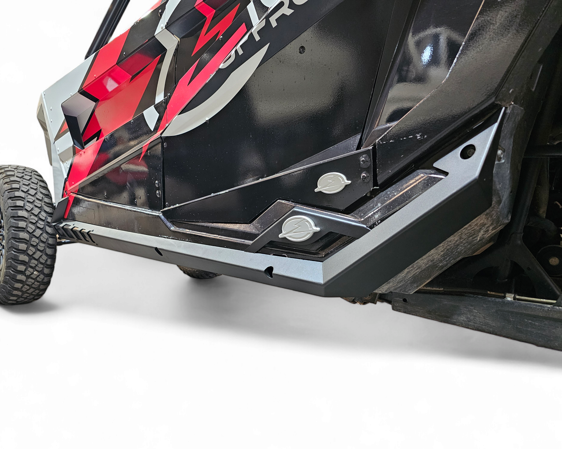 Side profile of Polaris RZR Pro R with Volt rock sliders installed