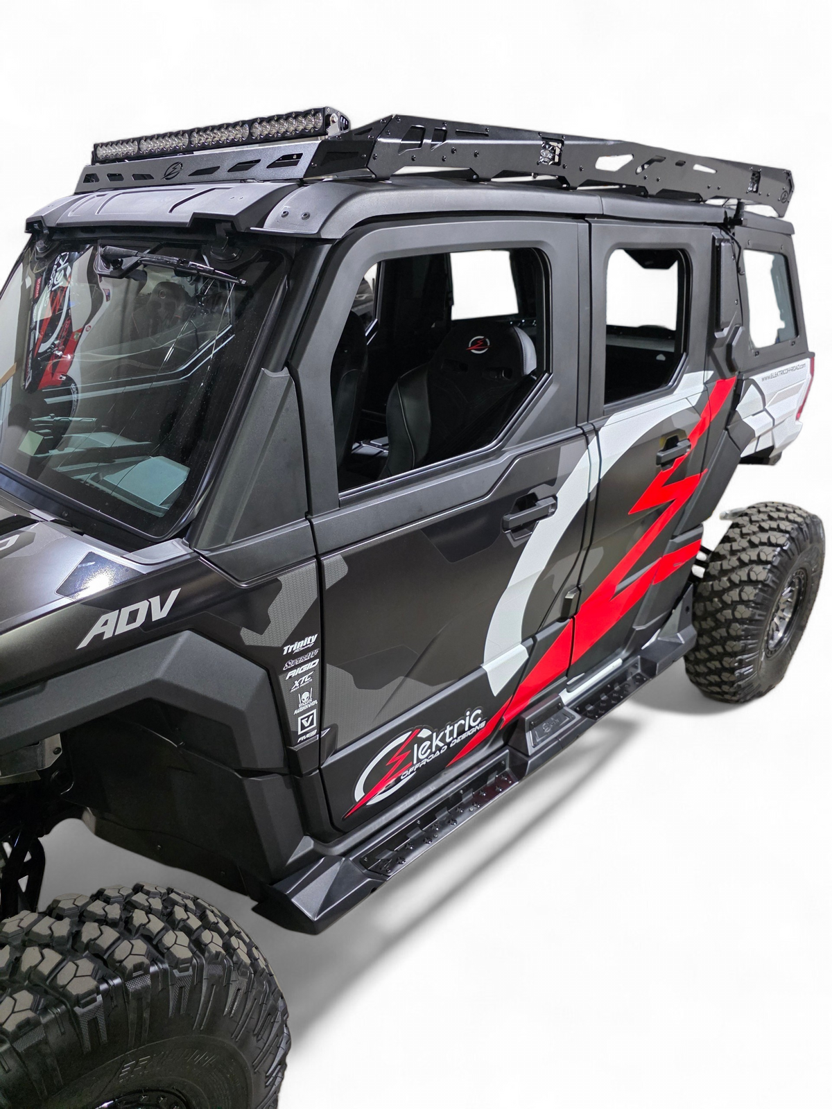 Front corner view of the Xpedition ADV5 with the roof rack installed and doors closed