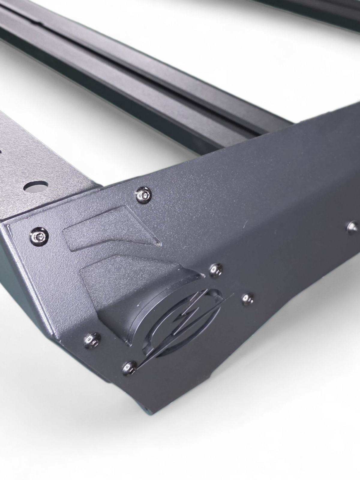 Close-up of a roof rack corner cutout and rail end