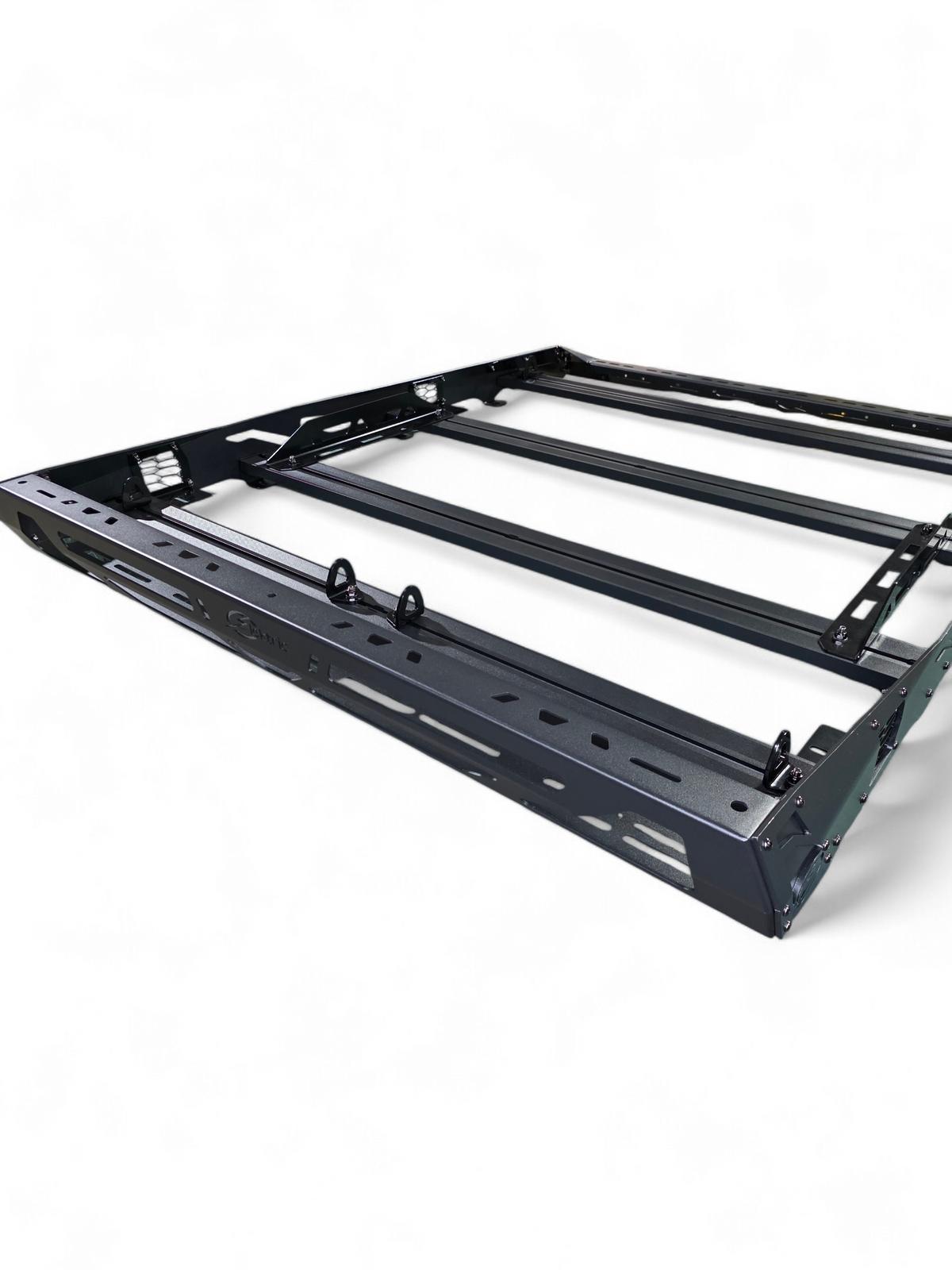 Low-angle view of the roof rack crossbars and rail mounting tabs